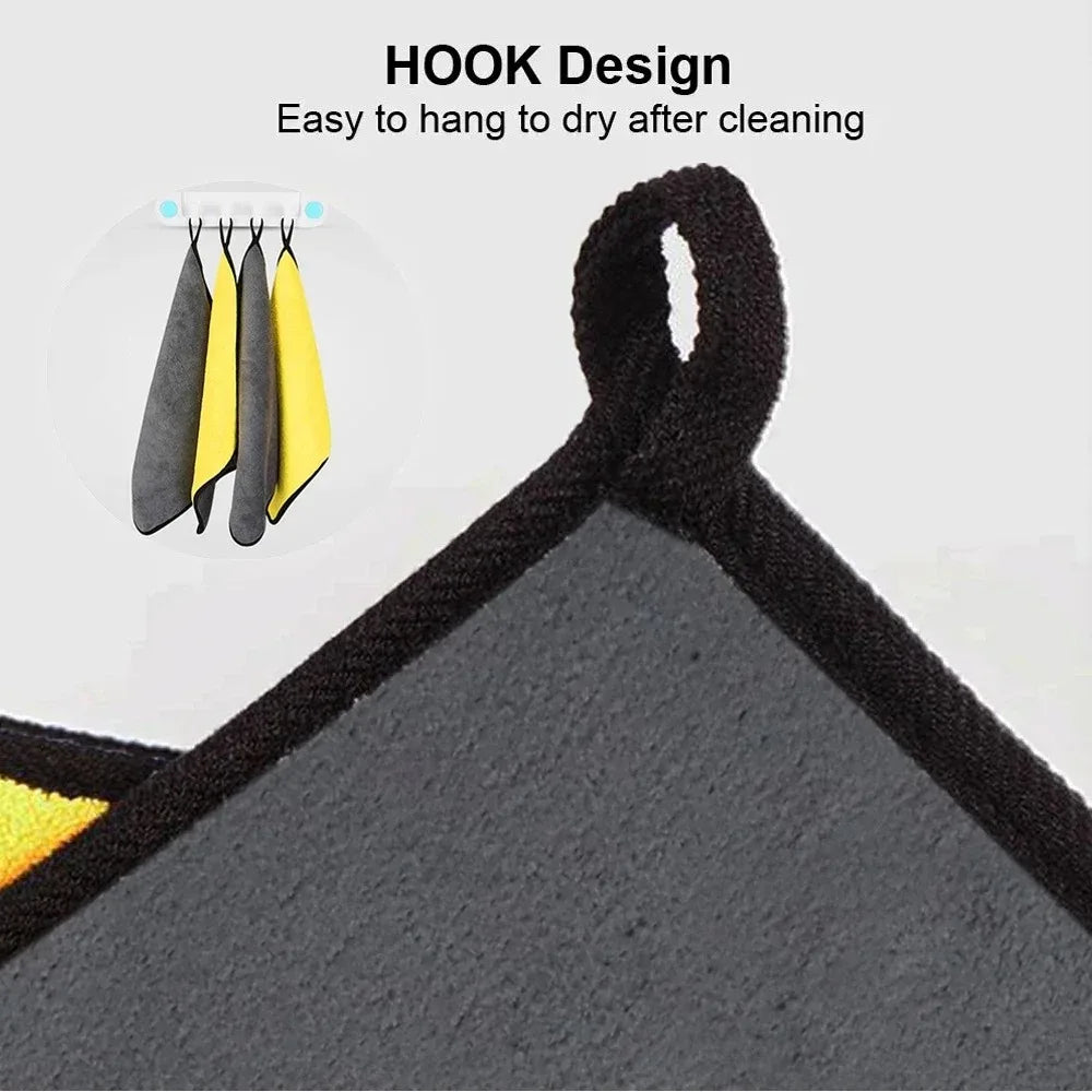 A set of black and yellow microfiber car cleaning towels with hook designs for easy drying.