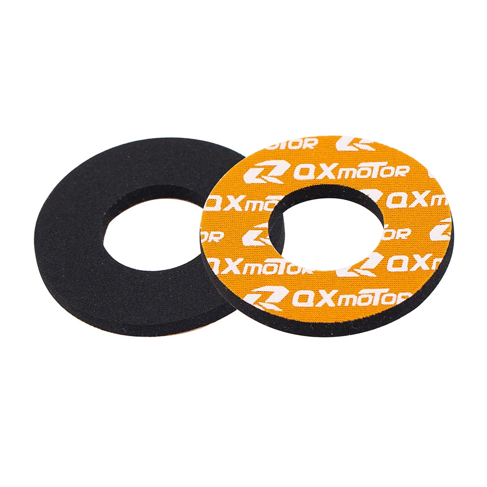 Two circular handlebar grips, one black and one orange, for dirt bikes.