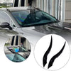 Black dragon horn car roof decor featuring curved, glossy horns installed on a vehicle roof.