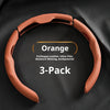 Orange PU/Nappa Leather steering wheel covers in a 3-pack shown against a dark background.
