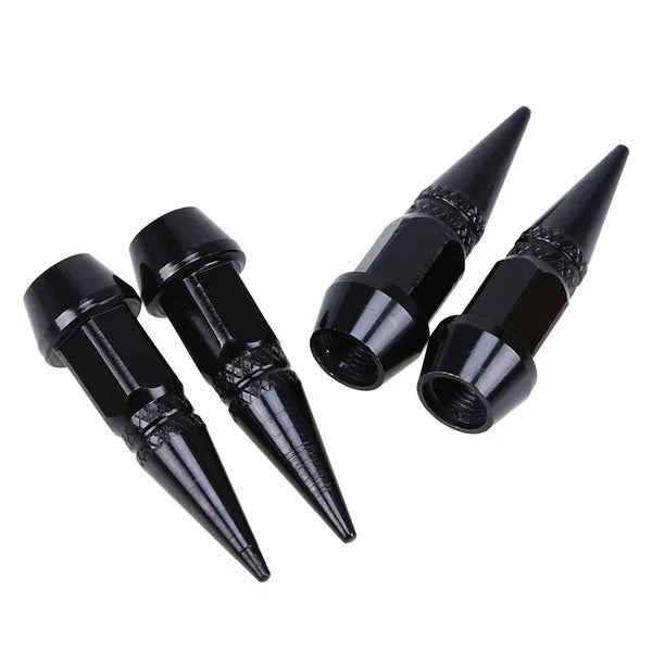 Set of four black aluminum tire valve stem caps with pointed tips