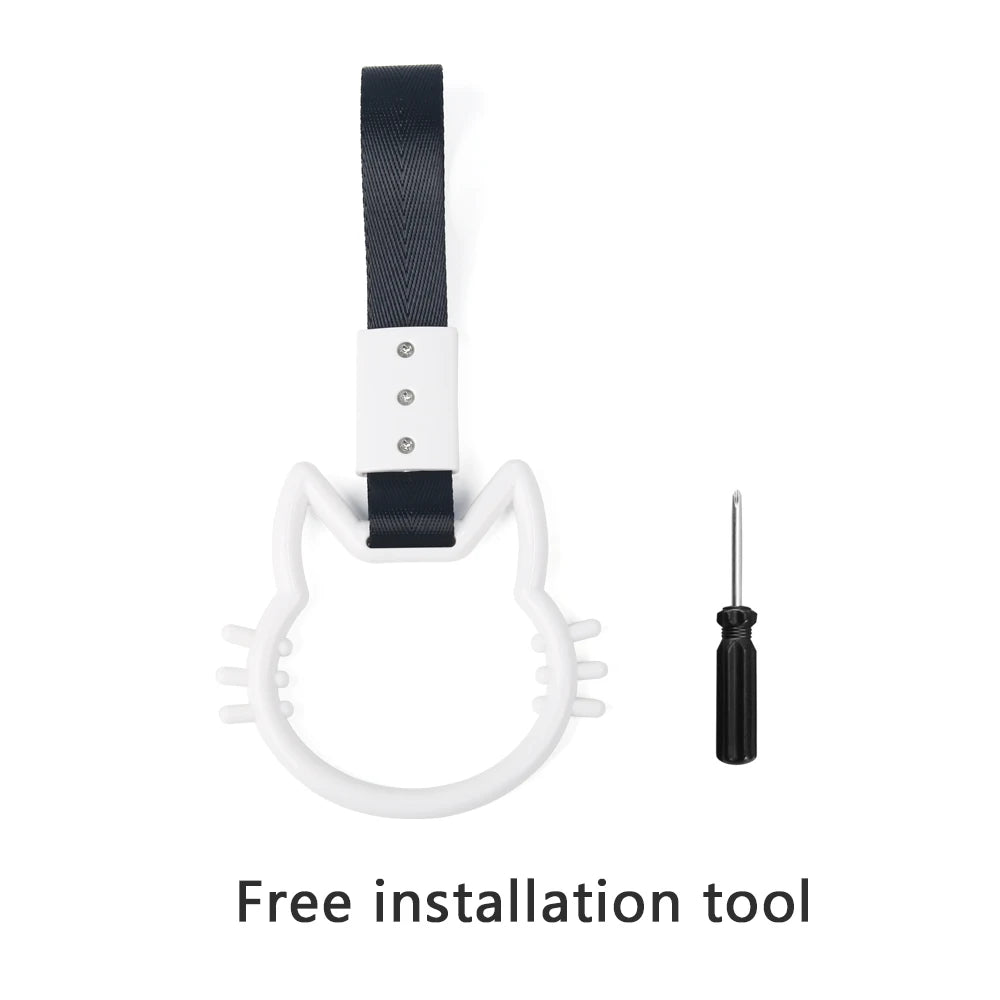 A black strap with a white plastic ring and a metal tool is shown for car rear bumper installation.