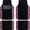 A set of four black car floor mats with sparkling pink diamond accents.