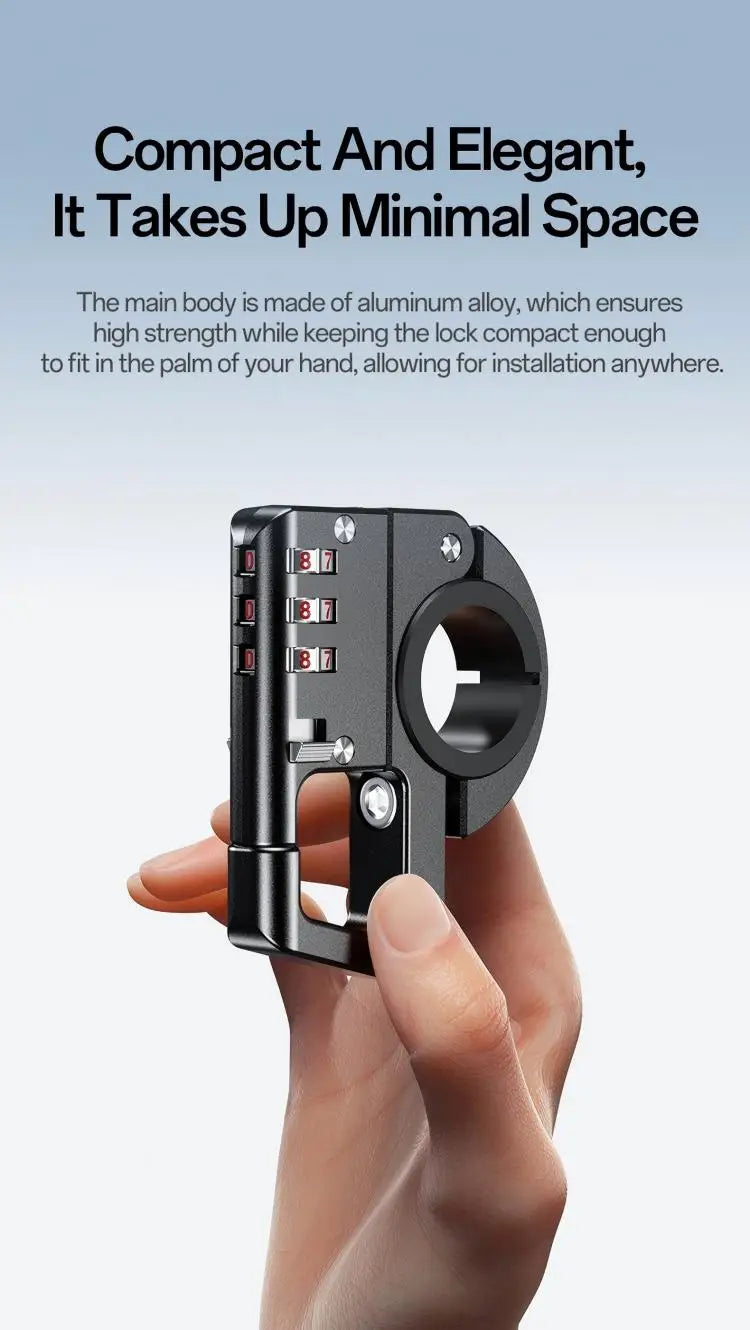 A hand holds a compact, black aluminum alloy motorcycle helmet lock designed for easy installation.