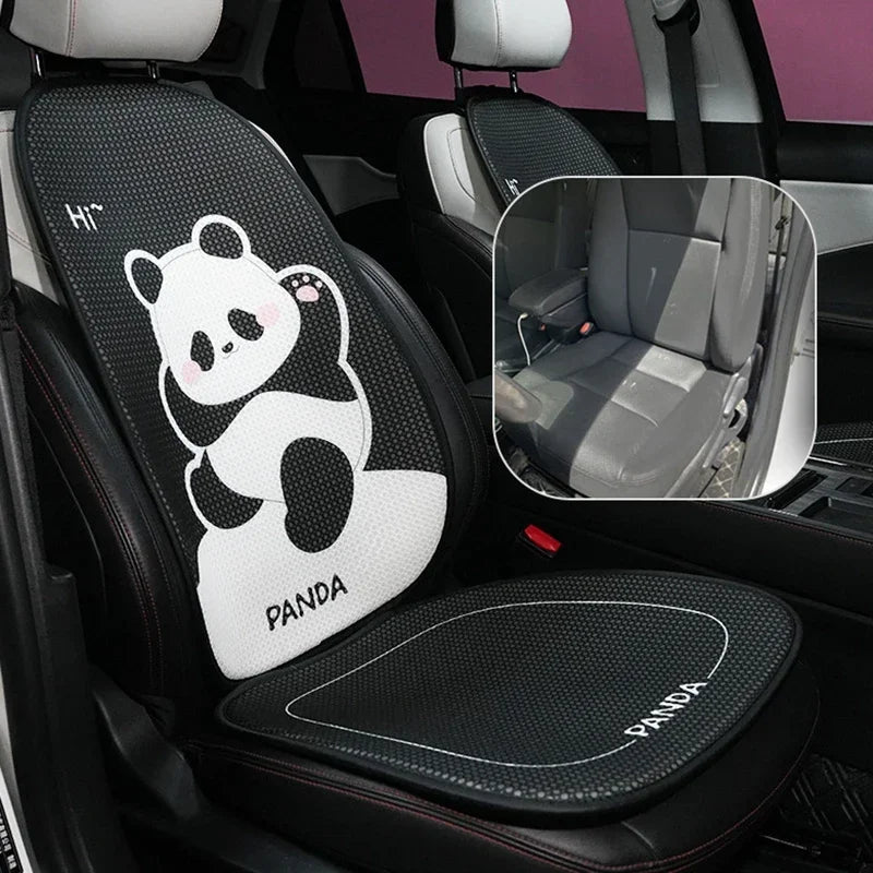 A black car seat cushion with a white panda design and a matching padded seat cover.