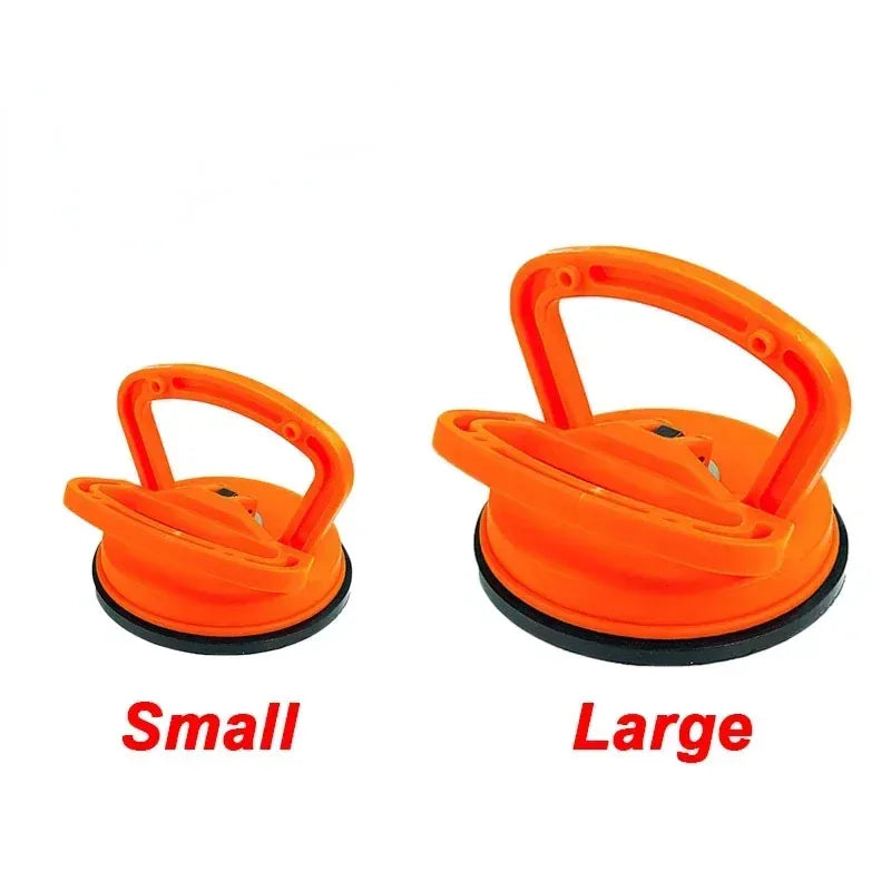 Two orange car dent glass suction removal tools, labeled small and large.