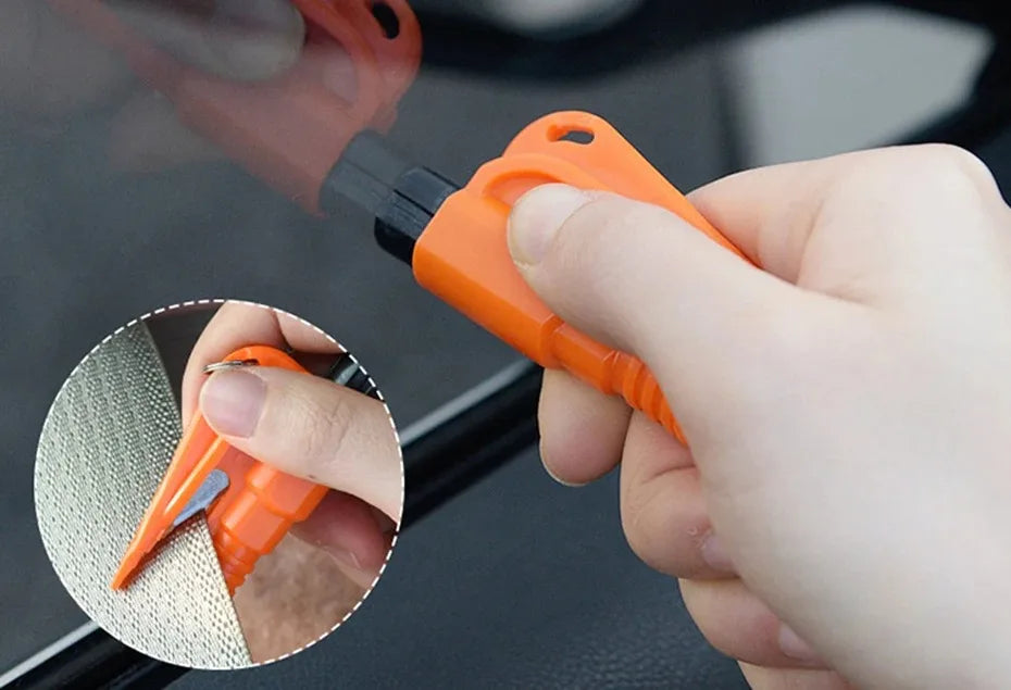 A hand holds an orange emergency car escape tool with a window breaker and seatbelt cutter, shown next to a close-up view of 