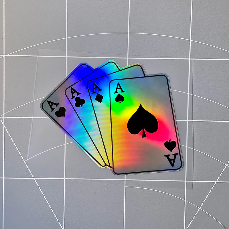 A set of rainbow-colored poker playing cards with aces displayed on a clear background.