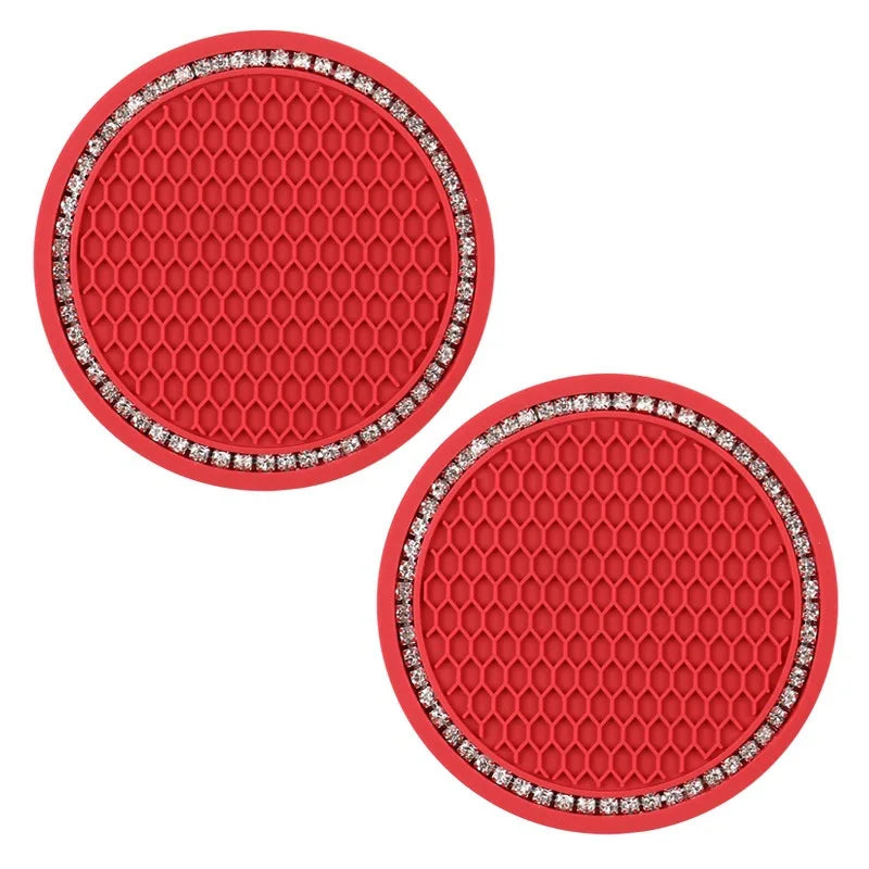 A set of red decorative rhinestone car coasters with a honeycomb texture.