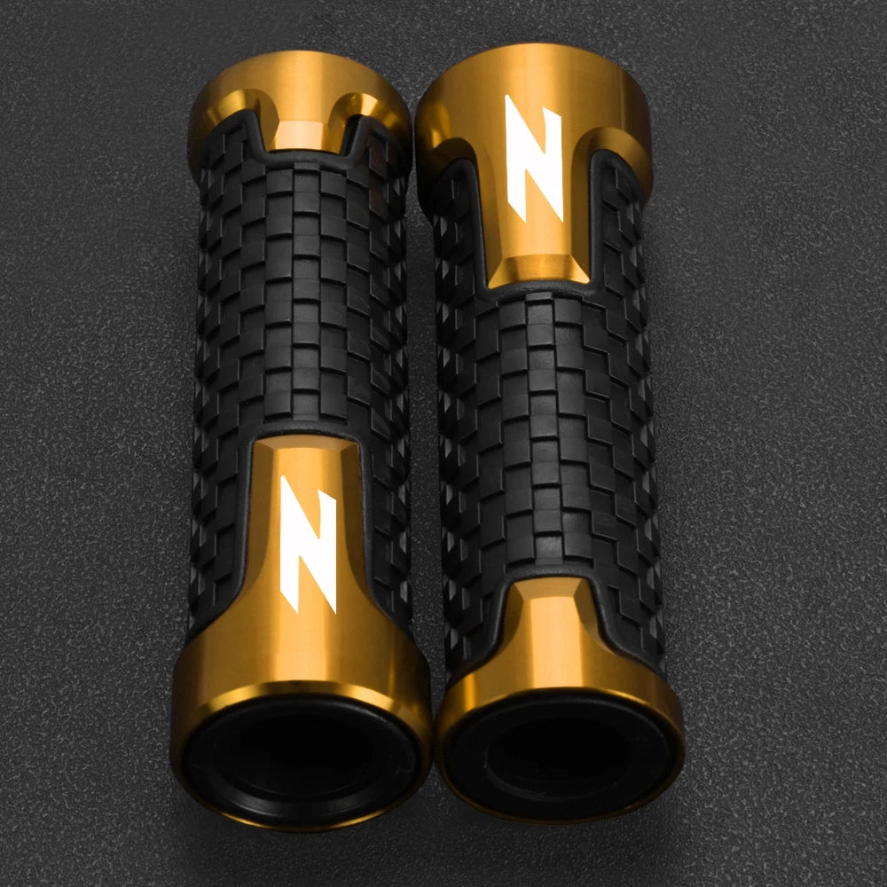 A pair of motorcycle lever and handguard protector sets in gold and black finish.