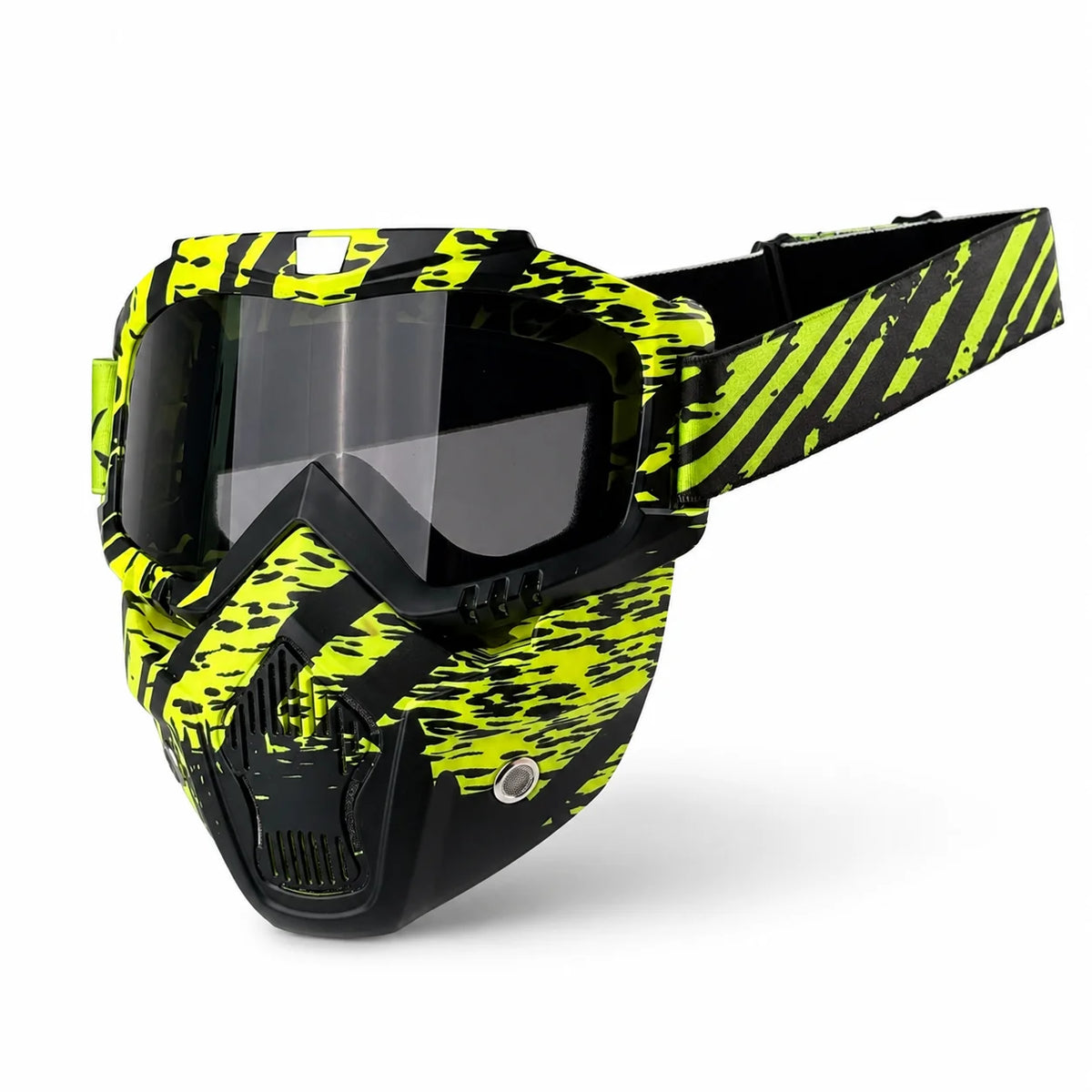 A tactical full face motorcycle goggle with a black frame and yellow and black camouflage pattern.