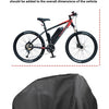 A black bicycle is shown with a black waterproof cover placed on the seat and frame.