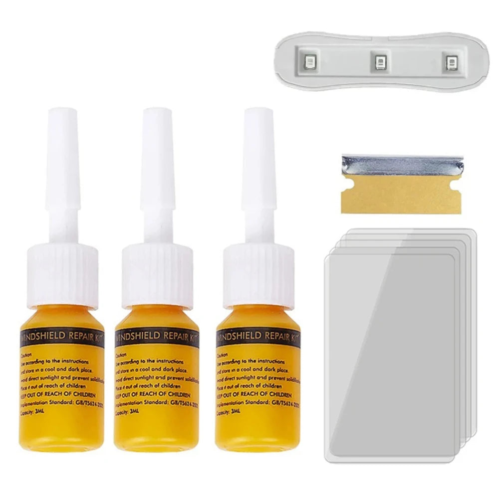A set of professional windshield crack repair kits including tools and adhesive patches.
