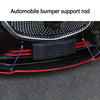 Close-up view of black automobile bumper support rods installed on a car's front grille area.