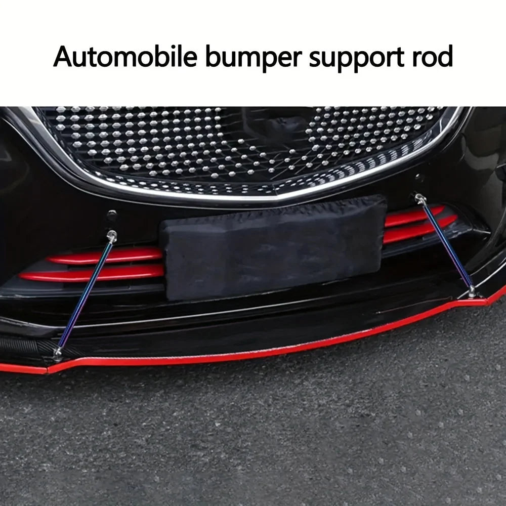 Close-up view of black automobile bumper support rods installed on a car's front grille area.