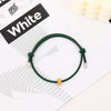 A green heart-shaped fitness tracker bracelet is displayed on a white background.