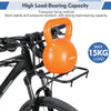 An orange, heavy-duty triangular fixing iron rack is mounted on a bicycle's front fork.