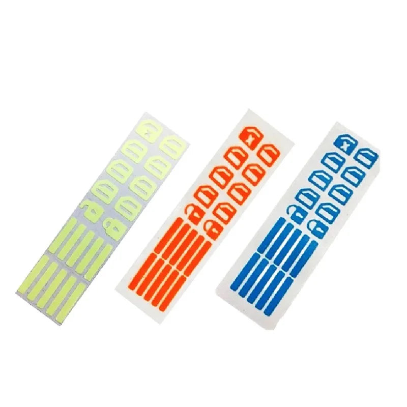 A set of car window luminous button stickers in yellow, orange, and blue colors.