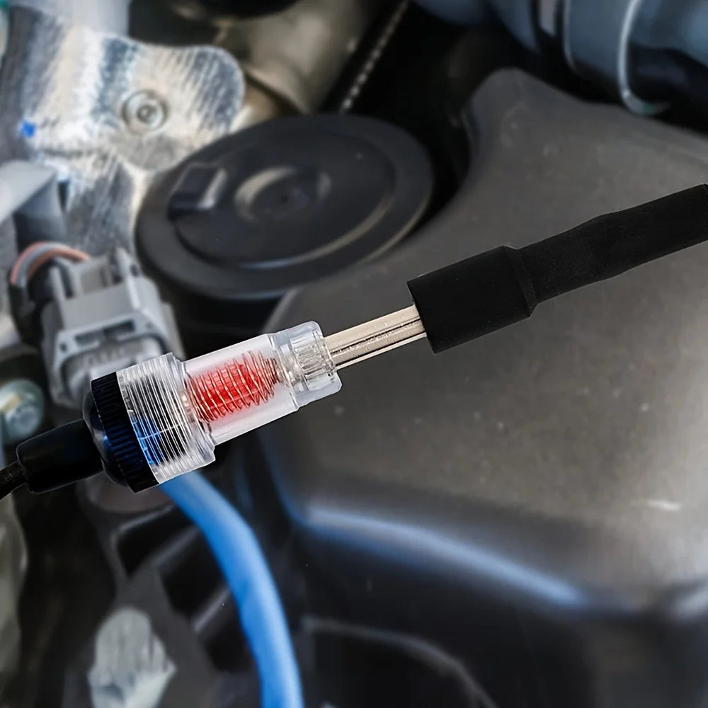 An automotive spark plug ignition tester kit with a black probe and red tip is shown in a close-up view.