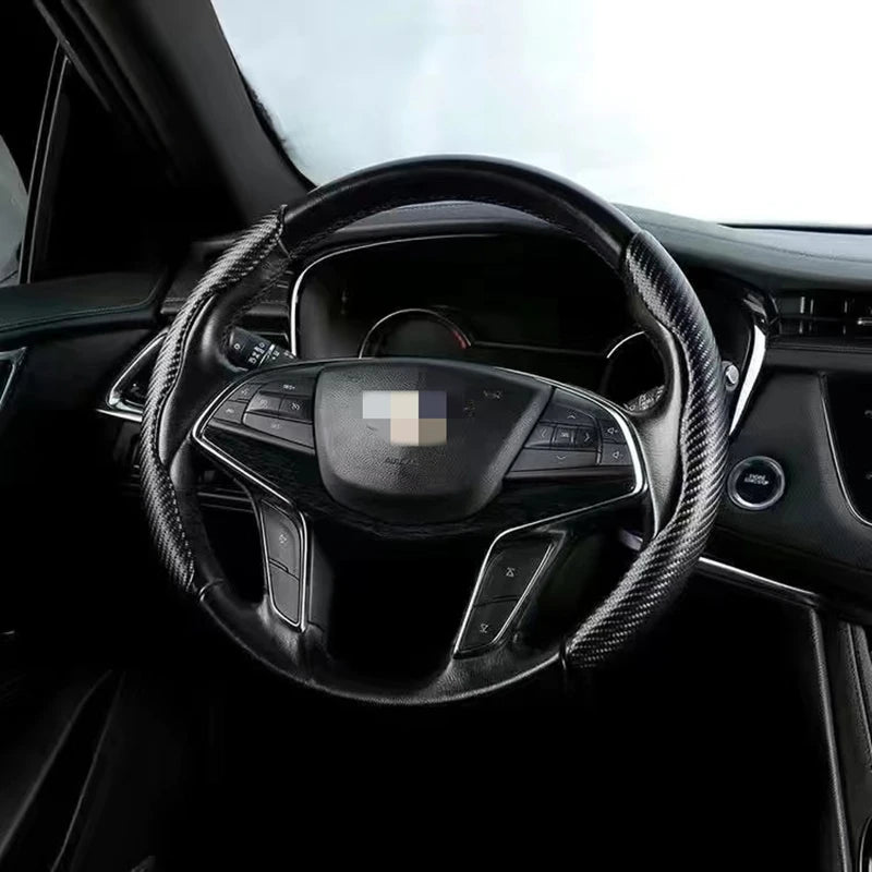 Interior view of a car steering wheel covered with ultra-thin carbon fiber material.