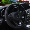 Black embossed leather steering wheel cover inside a car