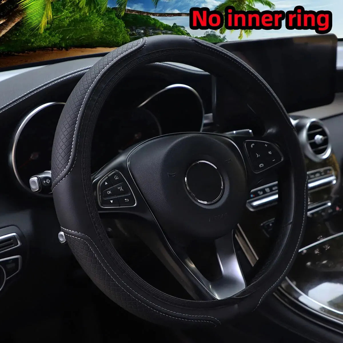 Black embossed leather steering wheel cover inside a car