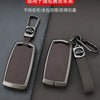 A metal key case for a car, featuring a dark brown rectangular design and a silver finish.