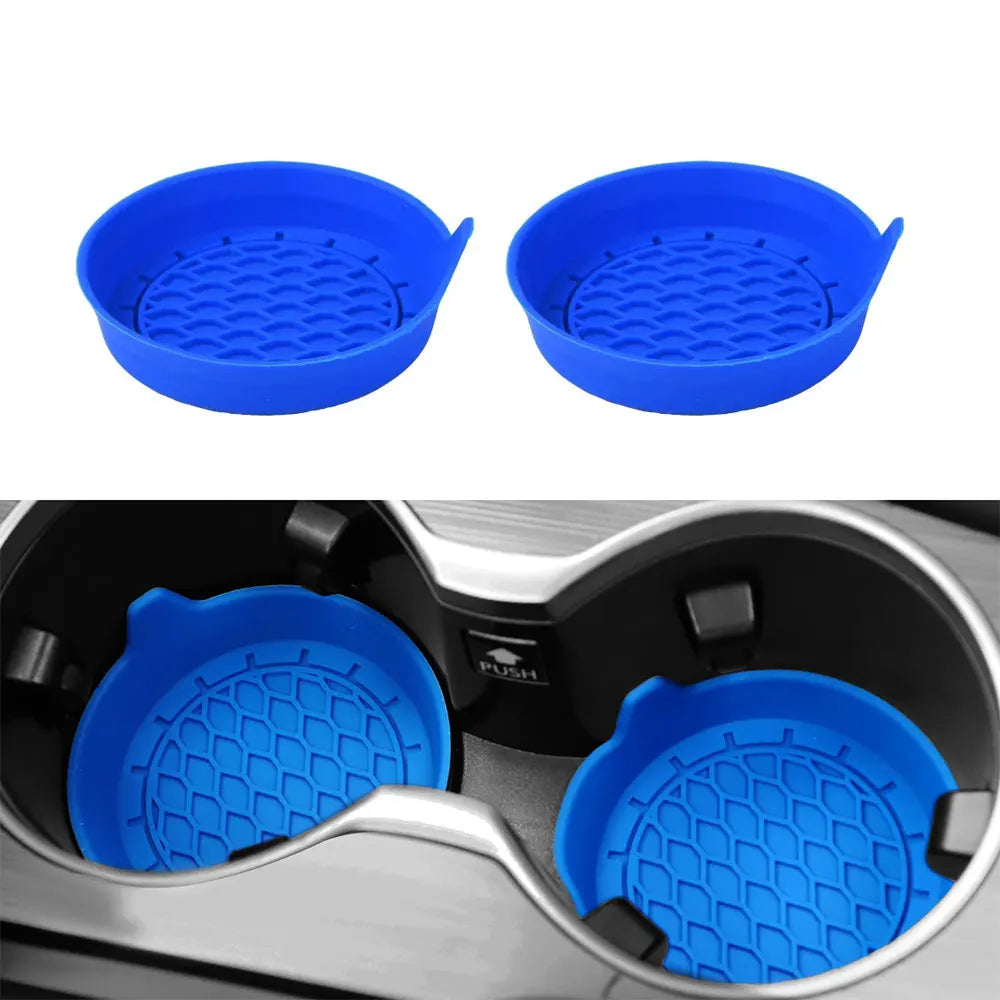 A set of blue silicone cup holder coasters shown in two views, including a close-up inside a car cup holder.
