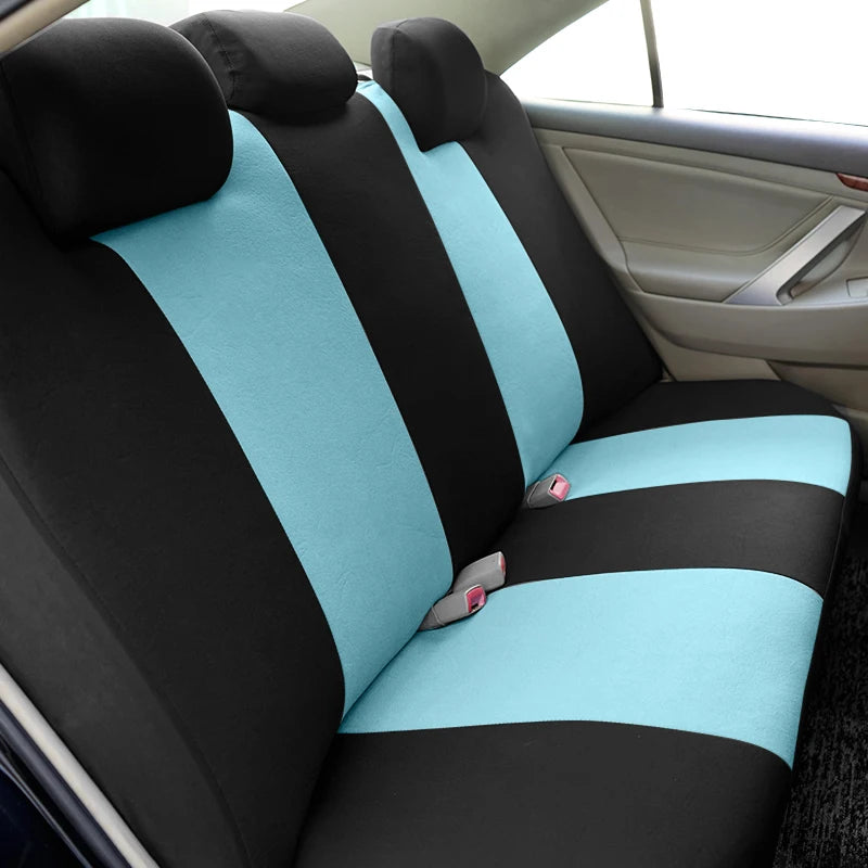 Autositzbezüge mit schwarz-blauen Streifen und Honigwabenstickerei