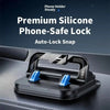 A black silicone phone-safe lock auto-lock snap mechanism mounted on a car bracket.