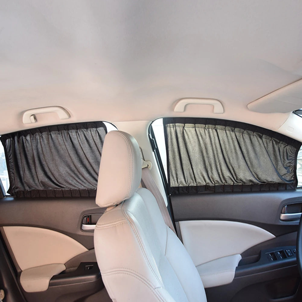 Interior view of a car showing a side window curtain shade on the rear seat.