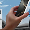 A hand holds an iPhone, demonstrating a magnetic phone holder accessory for various phones and cases.