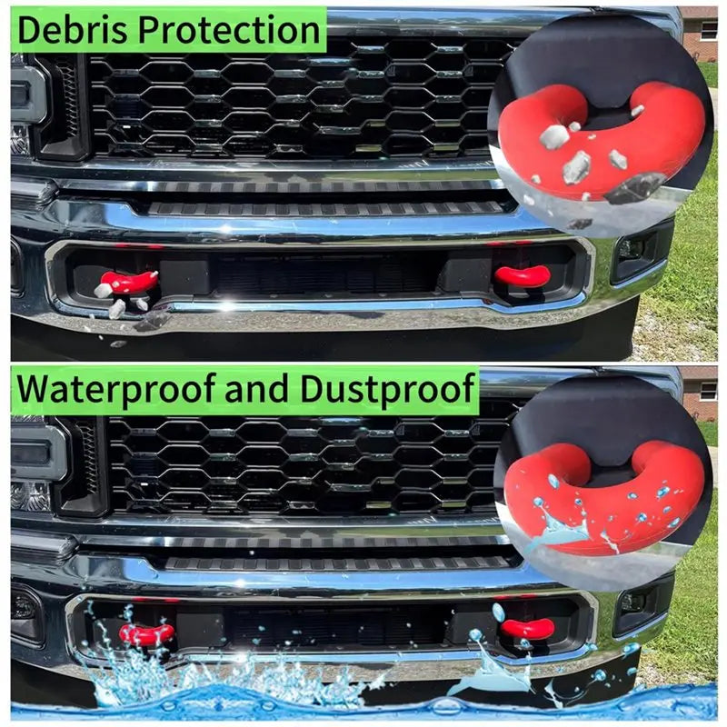 Red durable tow hook covers protecting the grille and bumper of a Ford Super Duty truck.