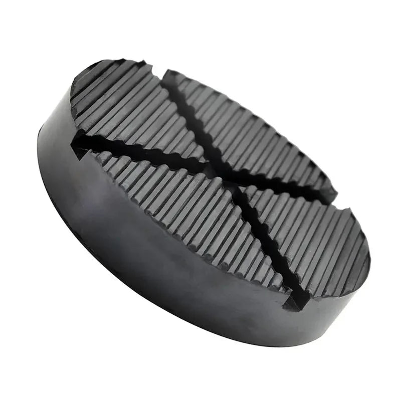 Black car jack point protection pads with a textured surface.
