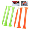 A set of vinyl car wrap tools in various colors including green and orange.