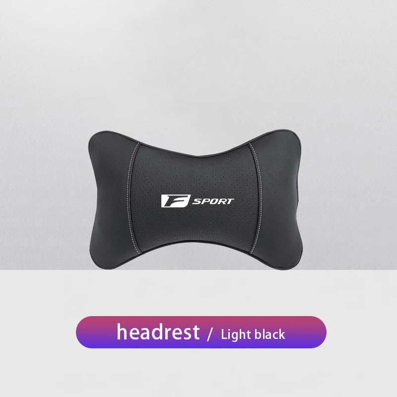 Black ergonomic neck pillow with an F Sport logo on a light gray background.