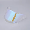 A clear anti-fog visor for a motorcycle helmet with a gold stripe visible.