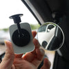 A hand holds a 360° adjustable HD blind spot mirror mounted on a car door, showing a reflection of the vehicle.