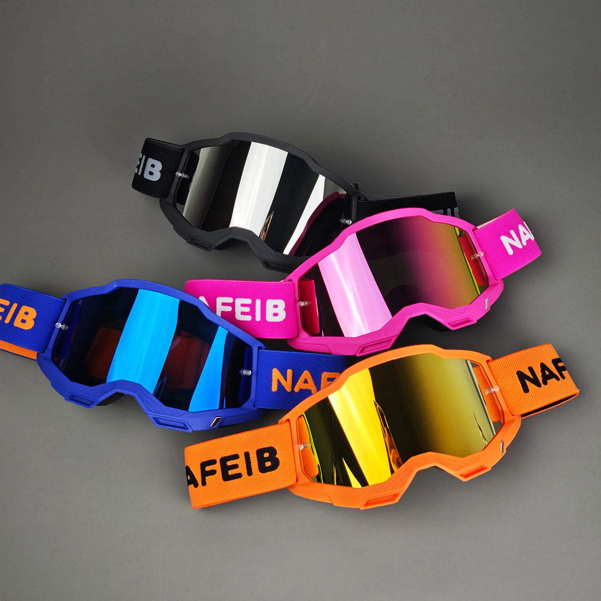 A collection of orange, pink, and blue off-road racing goggles with adjustable straps displayed on a gray background.