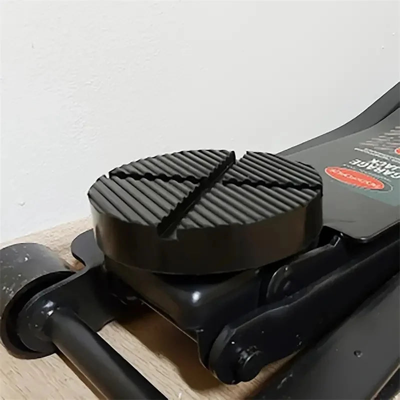 Black car jack point protection pads designed for undercarriage safety.