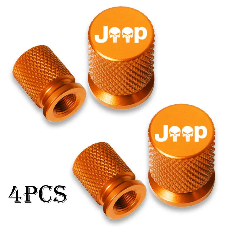 Four brass Jeep tire valve caps with skull designs shown in various angles