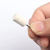 A hand holds a white wool felt polishing buffing wheel with a metal stick.