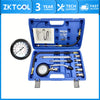 A blue portable engine compression tester kit with gauges and hoses is displayed in its packaging.