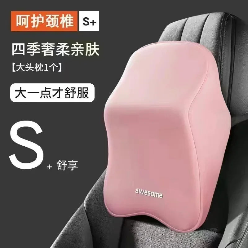 Pink ergonomic lumbar and neck support cushion placed in a gray chair