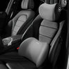 A close-up view of a black car seat with an installed gray headrest neck support pillow.