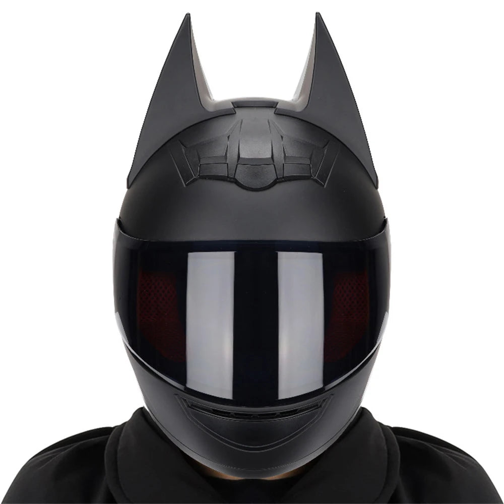 A black full face motorcycle helmet with detachable horns shown against a white background.