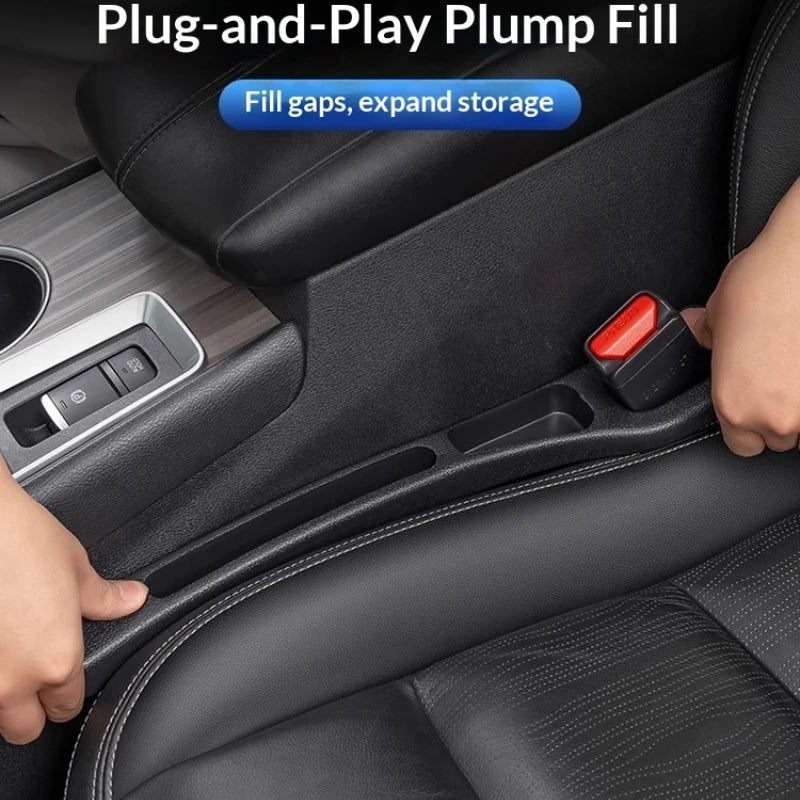 A hand is inserting a red plug-and-play filler strip into a gap in a black car seat for storage expansion.