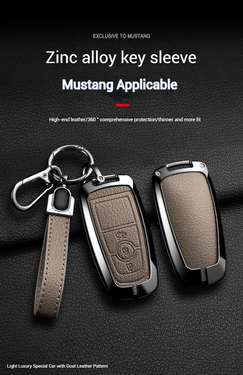 A close-up of a zinc alloy key sleeve and fob cover for a Mustang vehicle, showing the leather pattern and metal construction