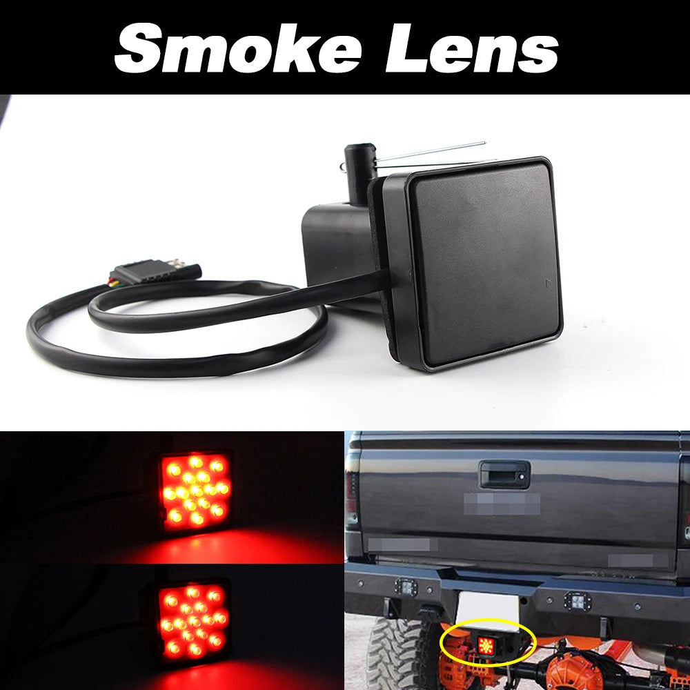 A black smoke lens product is shown with a wiring harness and an example of its red LED light illuminating a trailer hitch.