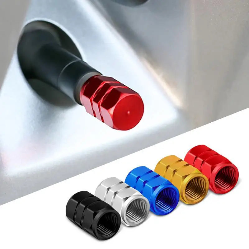 A set of four hex aluminum alloy tire valve caps in various colors including red, yellow, blue, and black.